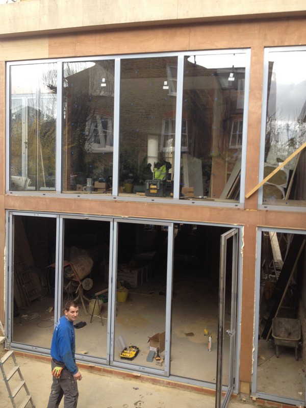Aluminium bi-fold doors with two-storey glazing in Earlsfield