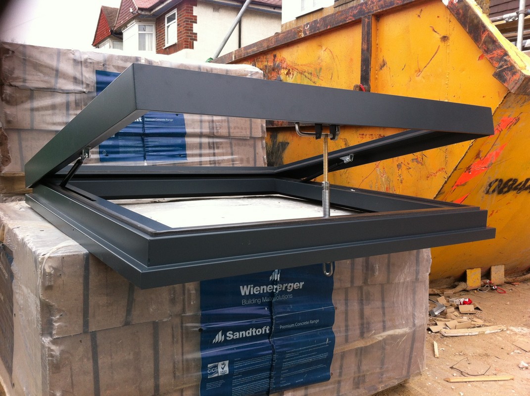 Opening flat roof skylight in anthracite grey installed in Earlsfield